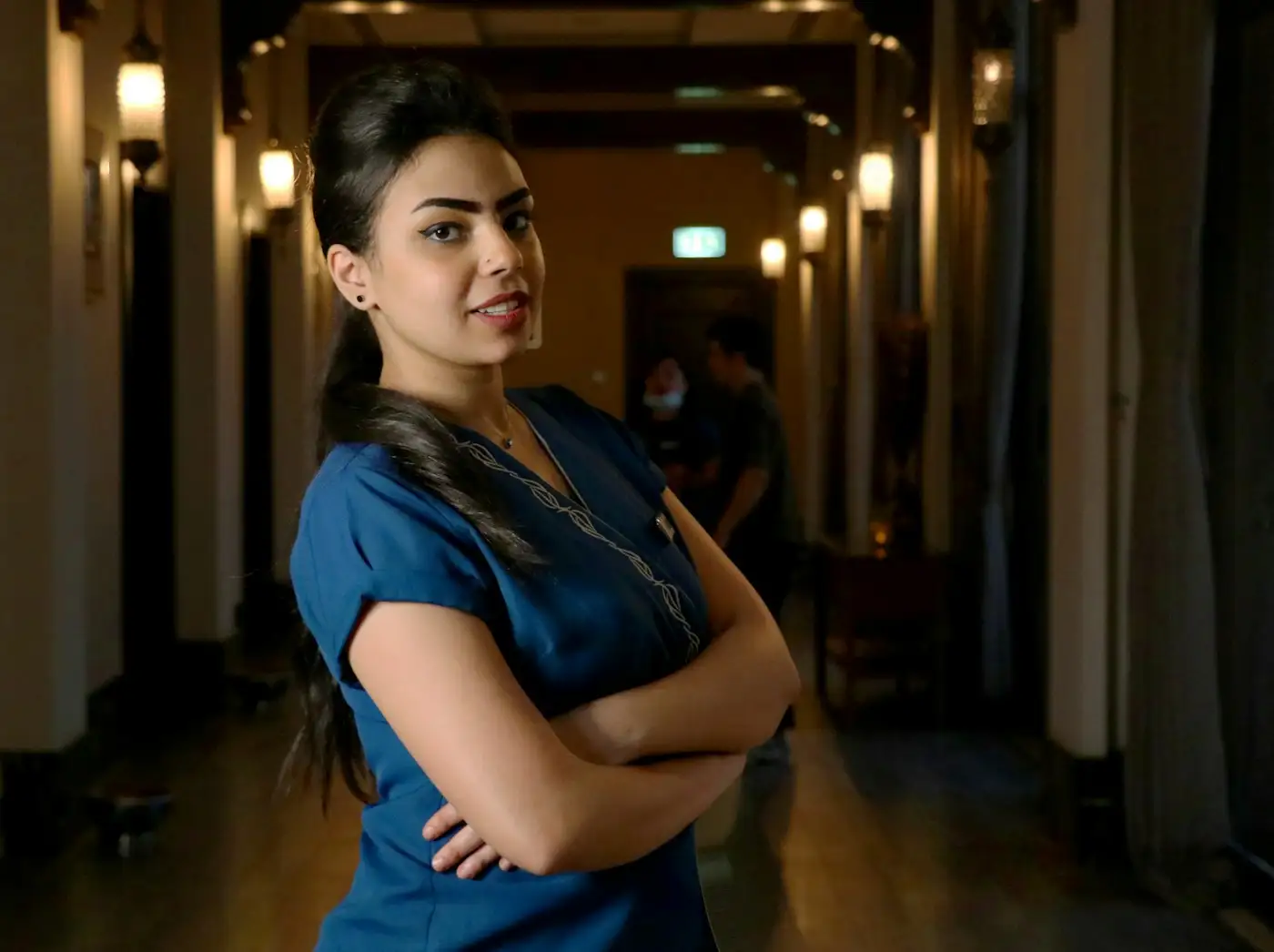 A registered nurse in a hospital corridor